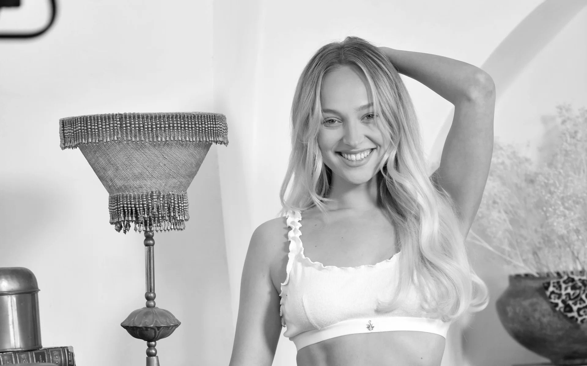 Woman smiling in the Ruffle Rib Hemp Bra and Thong.
